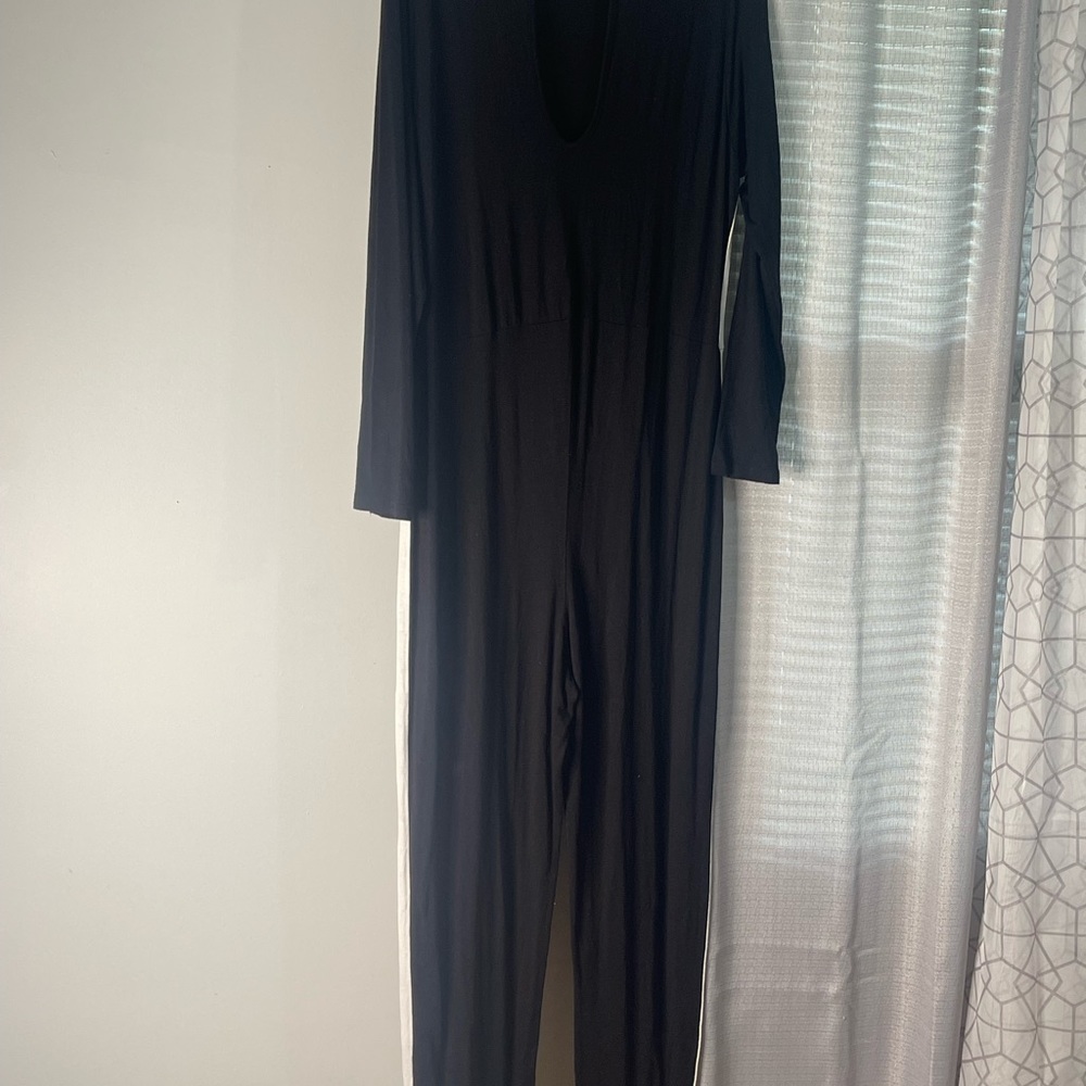 Black jumpsuit with white stripes on the side